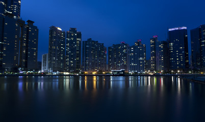 Fototapeta na wymiar Night view of modern buildings, Haeundae in Busan, South Korea