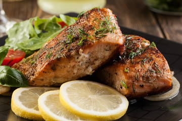 Fried salmon steak with vegetables