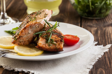 Fried salmon steak with vegetables