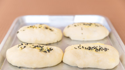 rows of buns in a bakery
