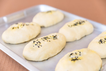 rows of buns in a bakery