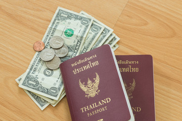dollar bills and coins thai passport