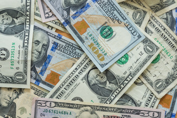 Fototapeta na wymiar variety of US dollar bills background