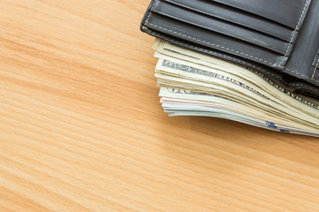 leather wallet US dollar bills