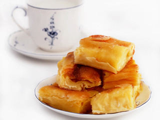Homemade cheese strudel and cup of milk