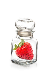 Strawberry in the  glass bottle