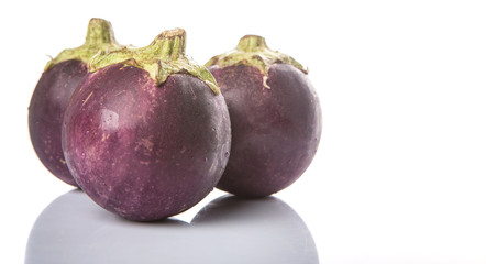 Round shape eggplant over white background