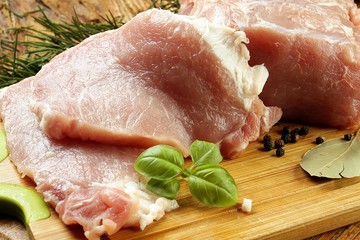 pork chop on a wooden chopping board