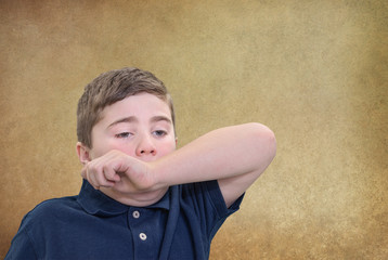 Boy Covering Sneeze with his Arm