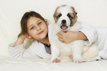 child and puppy