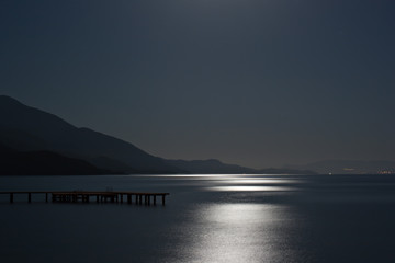 Blue moon reflected on the ocean