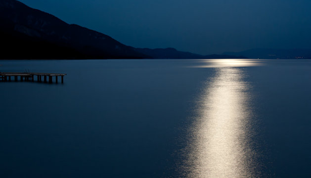 Blue moon reflected on the ocean