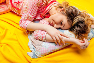 girl sleeping on the yellow sheet