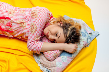 girl sleeping on the yellow sheet