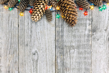 Christmas decoration with lights and pine cone