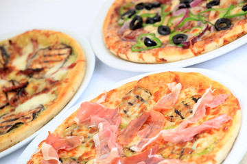 Close-up on freshly baked pizzas