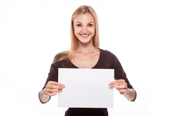 Naklejka premium Smiling woman show big blank board