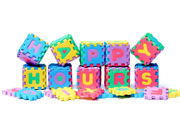Fototapeta na wymiar Jigsaw boxes arranged as a word happy hours