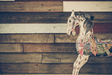 old wooden horse with wooden background