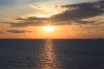 Remote Offshore Production Platforms in Sunset Time with Yellow