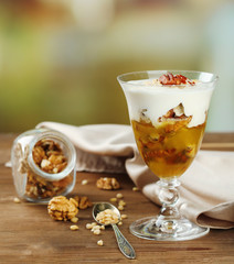 Tasty dessert with oat flakes and honey, on table