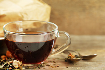Beautiful vintage composition with herbal tea, on wooden table