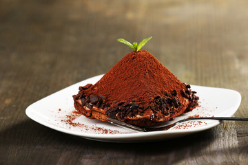 Yummy chocolate cupcake on table