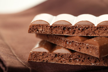 Tasty porous chocolate on table, close up