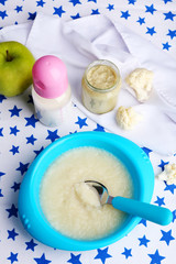 Fresh baby food in bowl with spoon