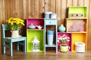 Beautiful colorful shelves with different home related objects