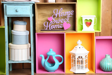 Beautiful colorful shelves with different home related objects