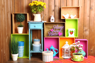Beautiful colorful shelves with different home related objects