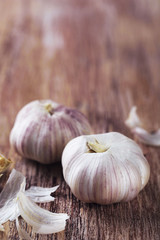 Raw garlic on wooden table
