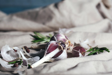 Raw garlic and spices on old cloth