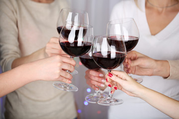 Woman hands with glasses of wine close-up