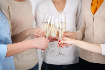 Woman hands with glasses of champagne