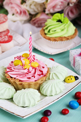 Fototapeta na wymiar Sweet cakes on birthday table close-up