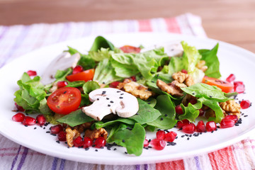 Fresh salad with greens, garnet and spices