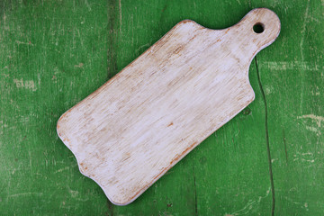 Empty cutting board on wooden background