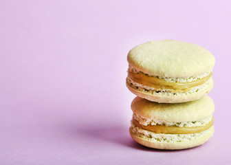 Gentle colorful macaroons on color background