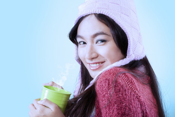Gorgeous girl holding hot coffee