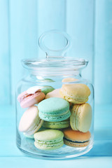 Gentle colorful macaroons in glass jar