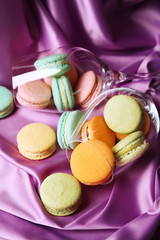 Gentle colorful macaroons in wine glass