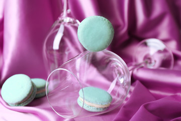 Gentle colorful macaroons in wine glass
