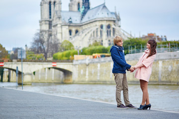 Dating couple on the Seine embankment in Paris