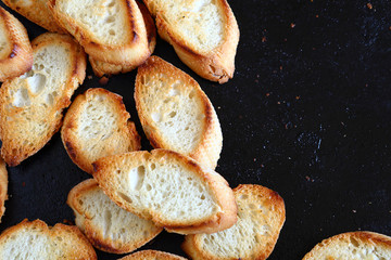 Baked baguette slices on a baking tray