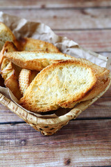 Pieces of  toasted bread in a basket