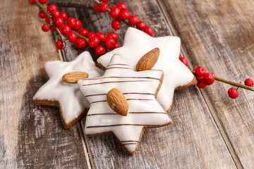 Gingerbread cookies in star shape decorated with almonds