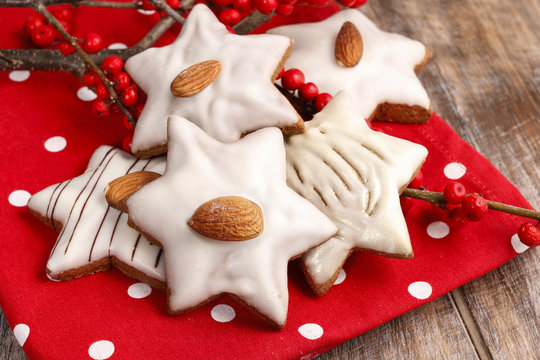 Gingerbread cookies in star shape decorated with almonds