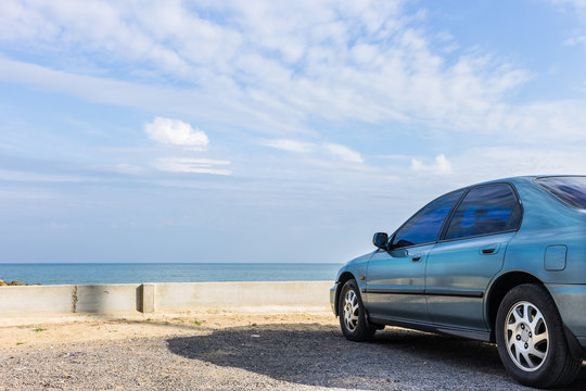 Car Parked On The Beach